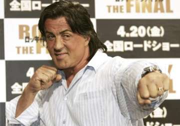 File pic - Sylvester Stallone poses for a photo in Tokyo. 