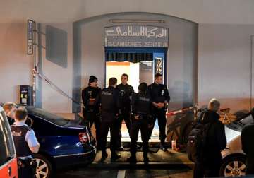 Policemen secure the area in front of the Islamic centre after a shooting 