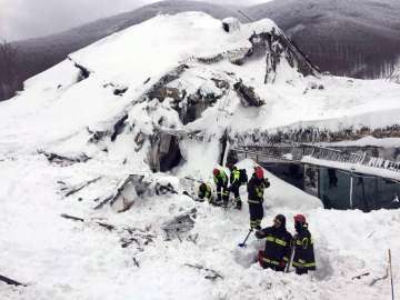 Italian firefighters search for survivors after an avalanche buried a hotel