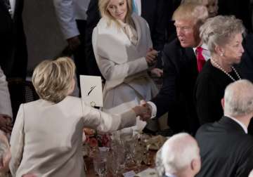 Donald Trump shakes hands with Hillary Clinton 

