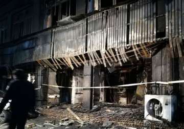 Massage parlour managers held over fire mishap that killed 18