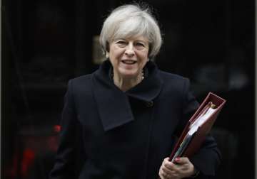May leaves 10 Downing Street in London to attend PM's Questions at Parliament
