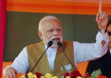 Narendra Modi addresses at an election rally in Fatehpur,