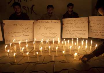 People take part in candle march after terror attack in Sindh 