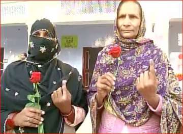 Female voters with Red roses