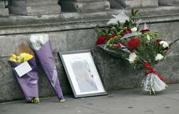 Flowers and a photo of police officer Keith Palmer, killed in Parliament attack 