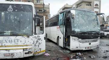 Rebels claim responsibility for twin Damascus bombings that killed 59