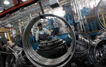 A worker at a manufacturing factory for cycle parts in Punjab. File photo