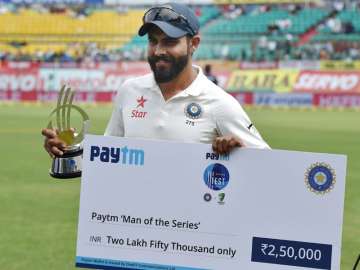 Jadeja poses in front of camera with 'man of the series' trophy after 4th Test