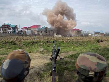 Budgam Smoke blowing out after forces blasted a house to kill a militant