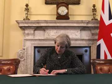 Theresa May signs the letter triggering Article 50 in Downing Street