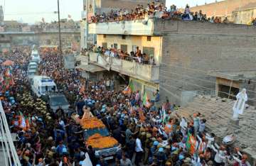 Prime Minister Narendra Modi during his road show in Varanasi on Sunday