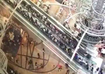 Escalator of Hong Kong shopping centre changes direction leaving crowd injured