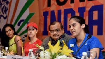 Nehwal speaks as Akhilesh Das Gupta, Sindhu, Marin look on during a pc