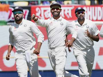 File pic - Rahane with teammate celebrate the wicket of Matt Renshaw