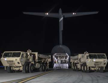 Trucks carrying missile launchers and other equipment needed to set up THAAD