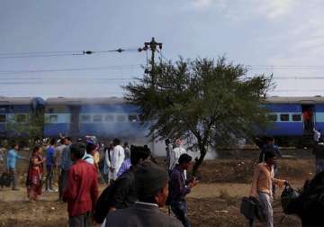 Smoke erupts from a bogie after a blast in the Bhopal-Ujjain passenger train 