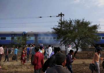 Smoke erupts from a bogie after a blast in Bhopal-Ujjain passenger train