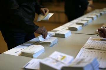 Tight, tense French presidential vote echoes around the world
