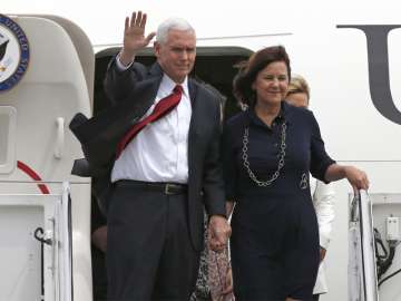 Mike Pence with his wife Karen arrive at US Navy's Atsugi air facility in Tokyo