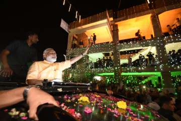 PM Modi reaches Surat, welcomed with road show