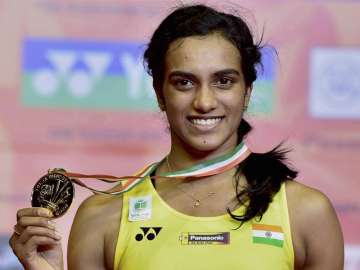 Sindhu poses with her medal after winning final of the India Open tournament