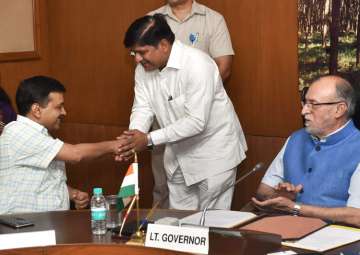 LG Baijal looks on as Kejriwal greets newly sworn-in minister Rajendra Pal 