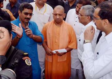 Adityanath being briefed about the bridge made on the Ganges in Varanasi