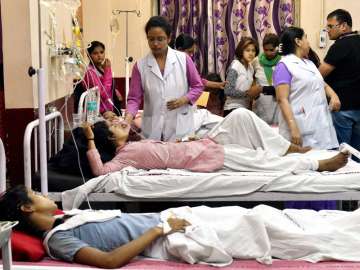 School students being treated at a hospital in New Delhi on Saturday