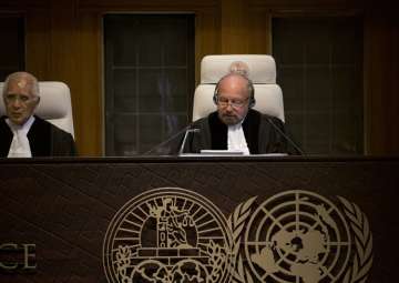 Presiding judge Ronny Abraham of France reads the Court's verdict in Jadhav case