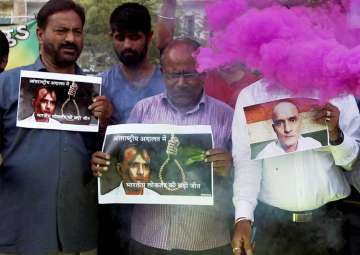 People celebrate with crackers ICJ verdict on Jadhav in Ahmedabad on Thursday