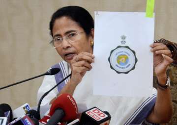 Mamata Banerjee speaks to reporters in in Kolkata