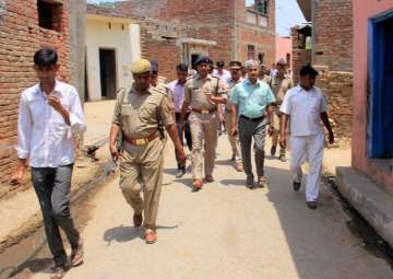 Administrative officials and the police patrol in the violence-hit Sabbirpur 