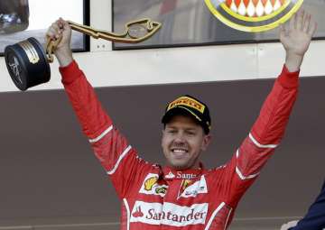 Sebastian Vettel celebrates after winning the Formula One Grand Prix