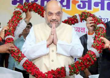 Amit Shah being garlanded during a meeting with party MPs, MLAs in Raipur