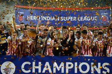 Atletico de Kolkata players celebrate with the trophy