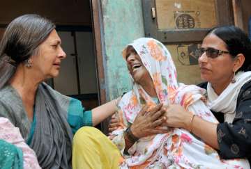 CPI(M) leader Brinda Karat consoling mother of Junaid 