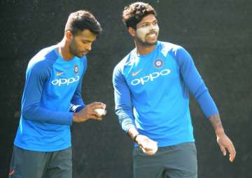 Hardik Pandya and Umesh Yadav bowl in the nets during a practice session