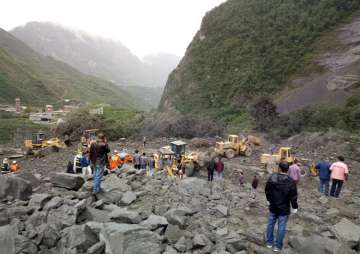 Over 100 people feared buried in southwest China landslide