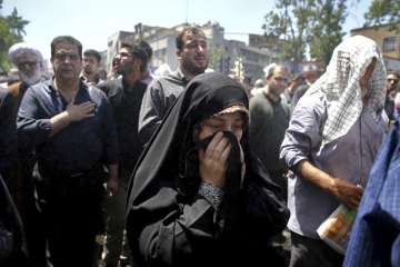 Iranians attend the funeral of victims of an Islamic State attack on Wednesday