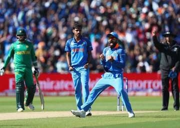 Virat Kohli celebrates the dismissal of a Pakistan batsman.