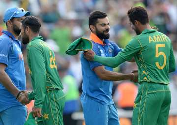Virat Kohli congratulates Mohammed Amir after Pakistan's victory over India.