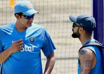 Anil Kumble and Virat Kohli interact during India's training session.