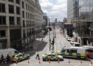 Police vans block access to a street after an attack in the London Bridge