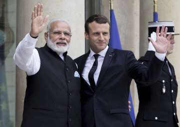 Macron welcomes PM Modi at Elysee Palace in Paris