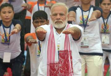 Modi performs yoga along with thousands of others in Lucknow
