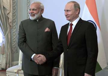 Putin shakes hands with Modi at the St. Petersburg International Economic Forum