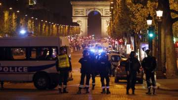 Car carrying arms and explosives rams police vehicle on famed Paris avenue