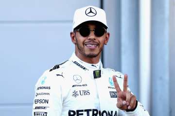 Pole position qualifier Lewis Hamilton of Great Britain and Mercedes GP