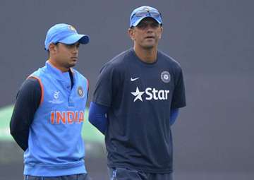 Ishan Kishan of India walks with coach Rahul Dravid of India